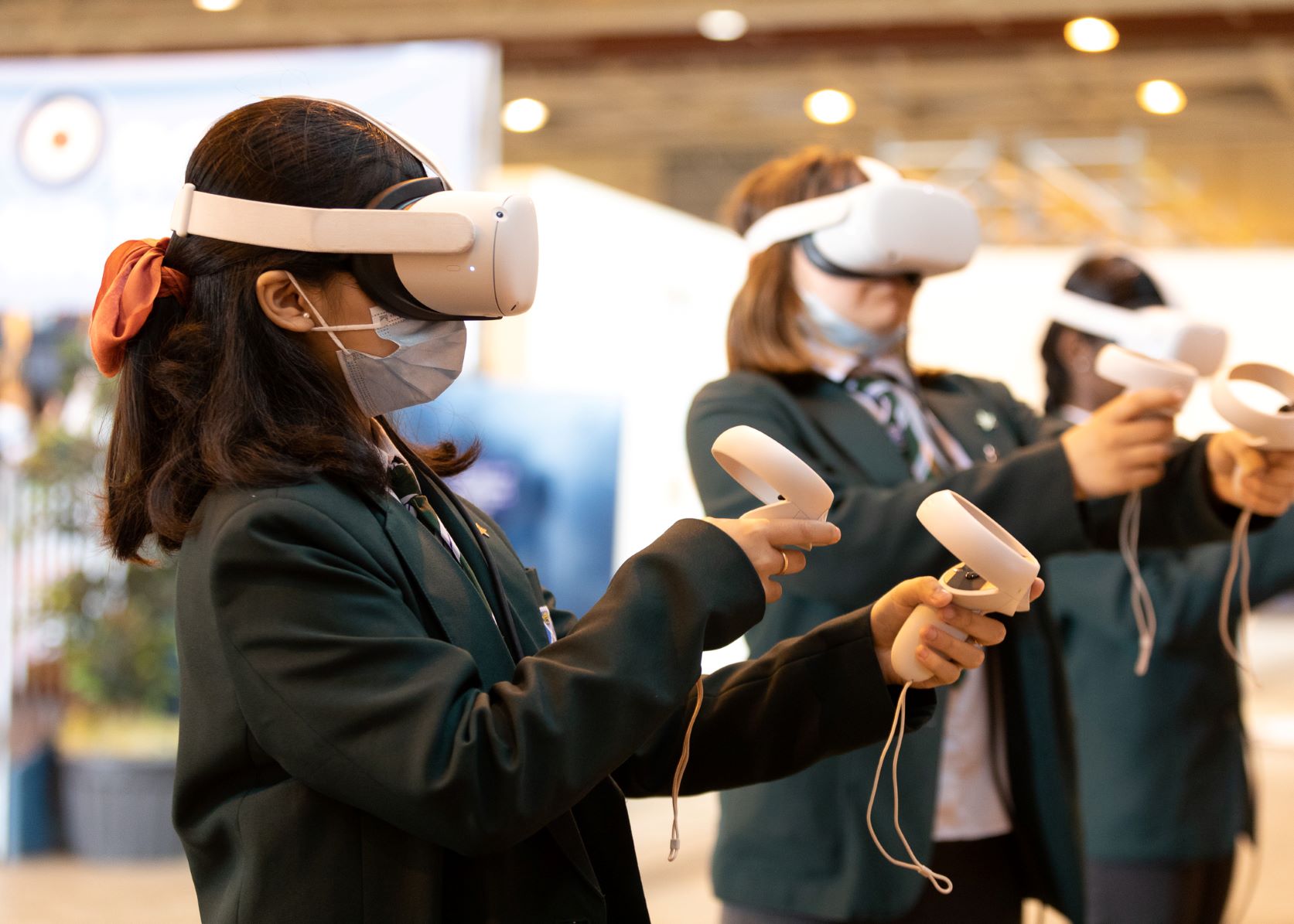 School children use VR headsets.